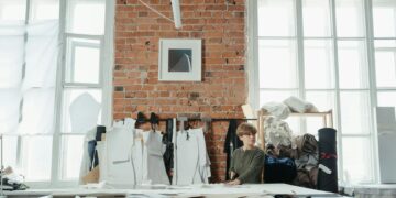 woman cutting curtain bangs at home