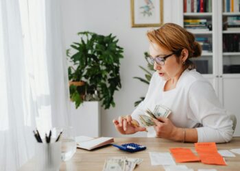 woman organizing budget workwear wardrobe