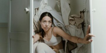 woman organizing wardrobe staples