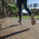woman running wearing tank top