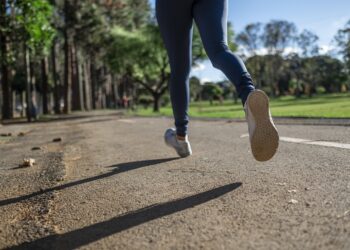 woman running wearing tank top