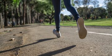 woman running wearing tank top