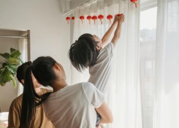 woman styling curtain bangs