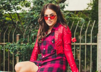 woman wearing red cardigan