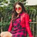 woman wearing red cardigan