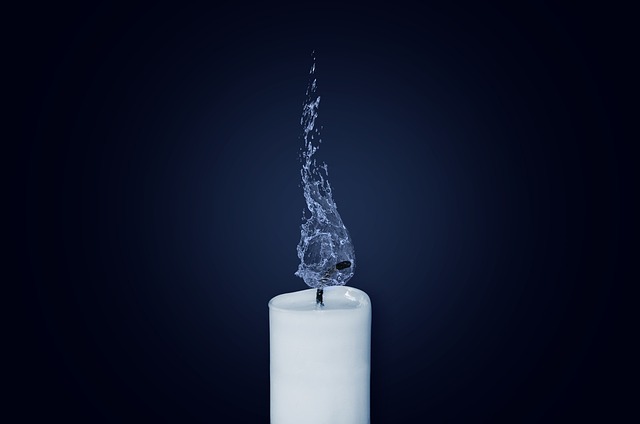 A bar of soapstone wax next to a container of mineral oil