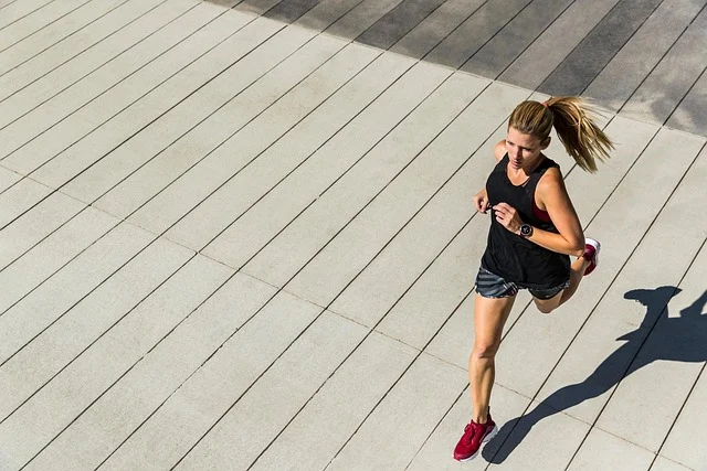A woman running outdoors wearing running shoes