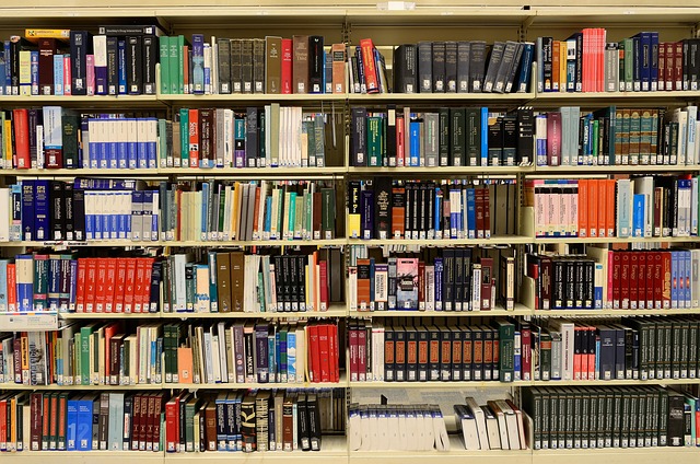 A bookshelf filled with books, many featuring Canadian authors and publishers.