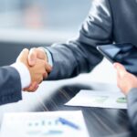 business owner signing loan agreement