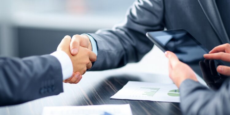 business owner signing loan agreement