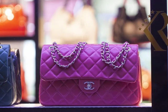 A pink Chanel quilted leather handbag on display in a store