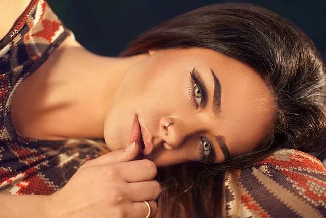 Close-up of a woman with well-defined, filled-in eyebrows