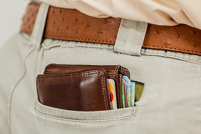 Close-up of a credit card with a distinctive logo, resting on a stack of shopping bags.