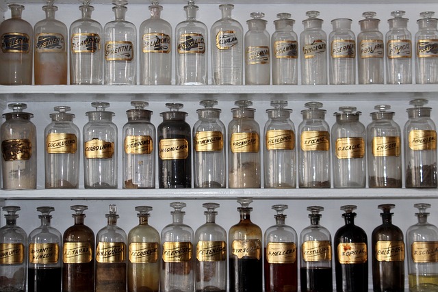 Collection of skincare bottles and jars labeled with ingredients like Vitamin C, Retinol, Niacinamide.