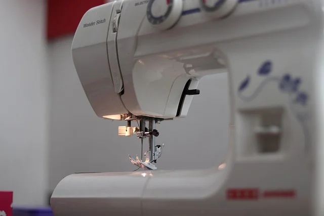 A close up of a white sewing machine