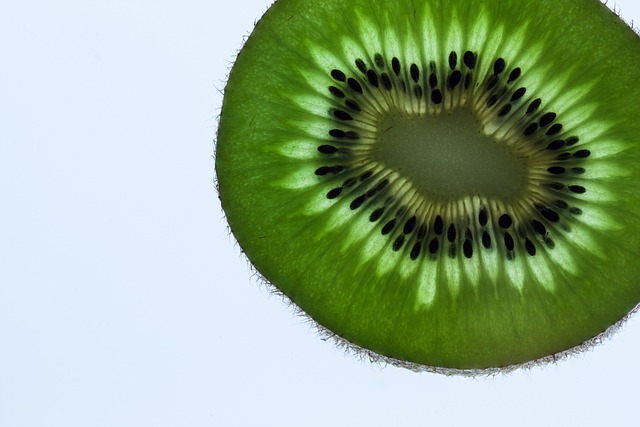 Cross-section of a large, ripe beefsteak tomato showing its meaty texture and multiple seed compartments.