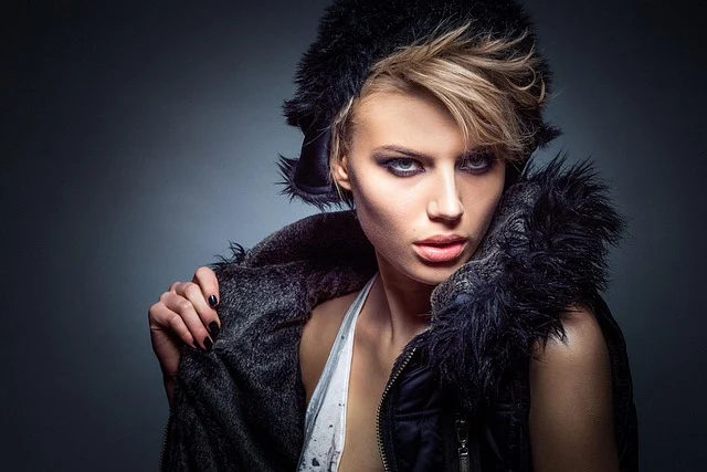 A female model in a fur hat and jacket studio portrait
