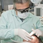 dermatologist examining patient's acne