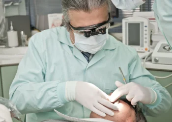 dermatologist examining patient's acne