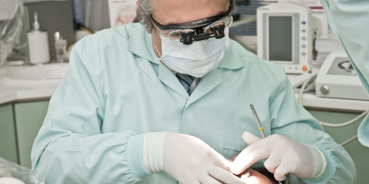 dermatologist examining patient's acne