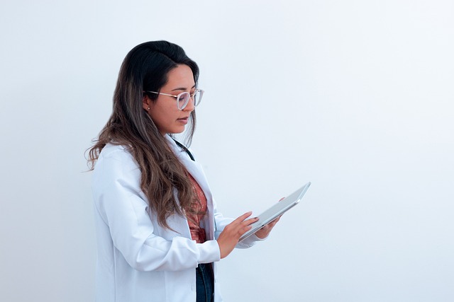 Doctor consulting with patient about hair transplant options (hair transplant cost)