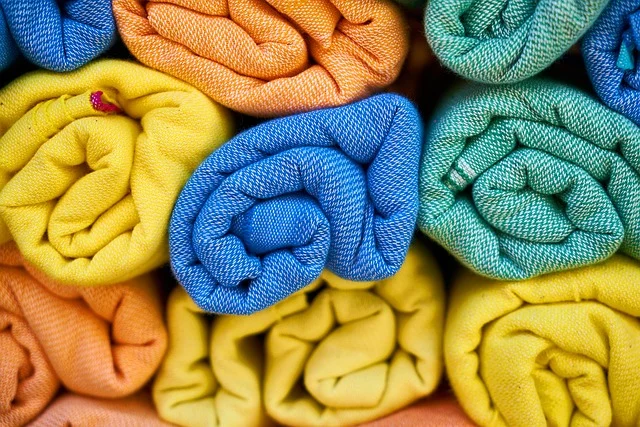 Rolls of colorful woven fabric and textiles