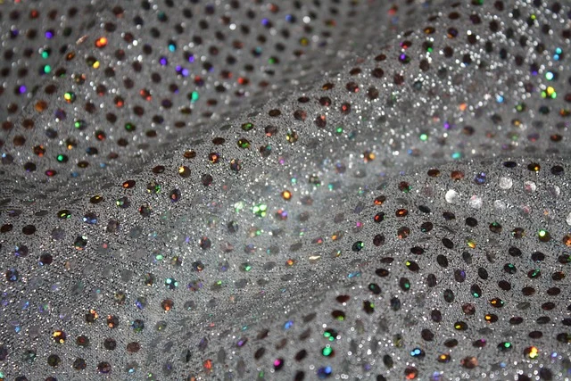 Close-up of shimmering glittery metallic fabric with sparkles