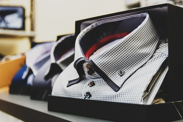 Folded men's patterned button-down shirt packaged inside a box