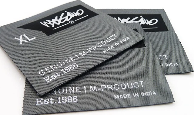 Clothing tags displaying text including Made in India