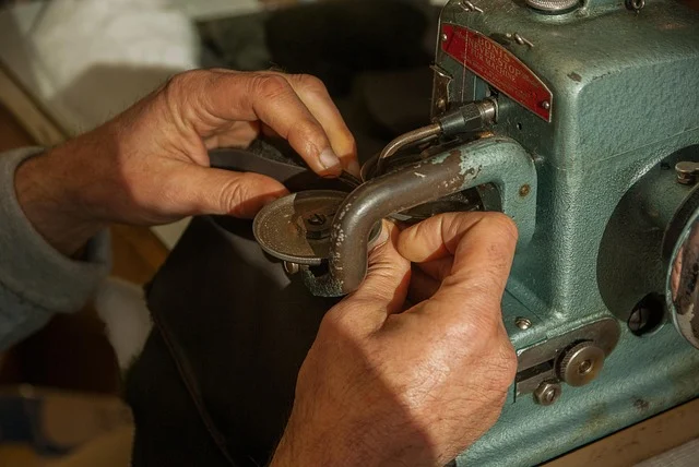 Artisan using a vintage sewing machine to craft leather