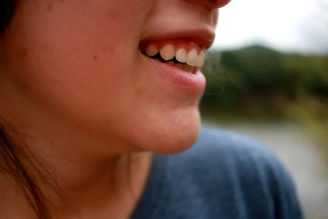 Close-up of a person's lower face, skin, and smile