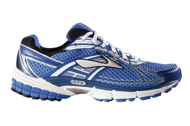A blue and white running sneaker on a white background