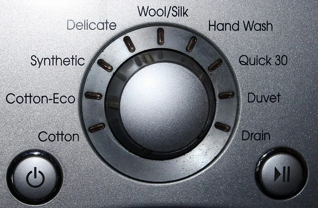 Close-up of a washing machine dial with cycle settings