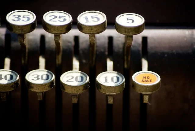 Close-up of vintage cash register keys with numbers and no sale button