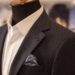man being measured for custom suit