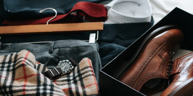 man choosing clothes from wardrobe