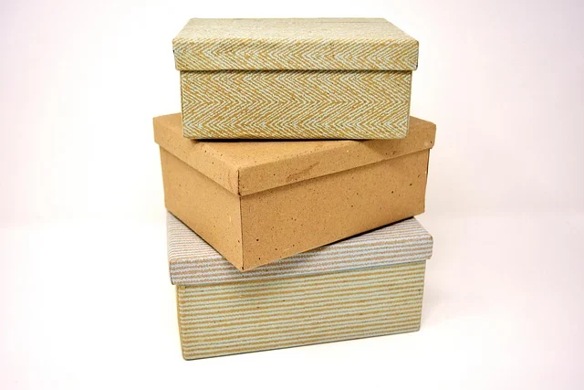 A stack of three decorative gift boxes on a white background