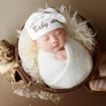 newborn baby clothes laid out