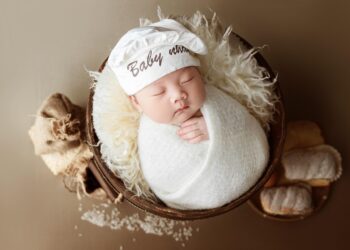 newborn baby clothes laid out