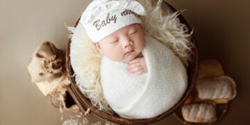 newborn baby clothes laid out