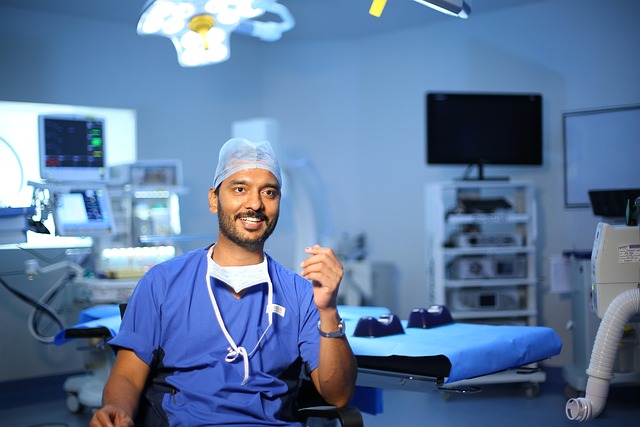 A patient smiling confidently in a dental chair after cosmetic dental work, with a dentist observing.