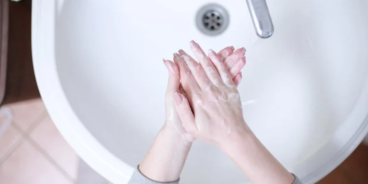 person applying skincare routine