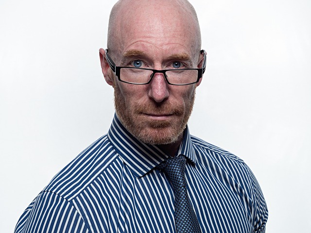 Person looking confused at a rack of designer glasses