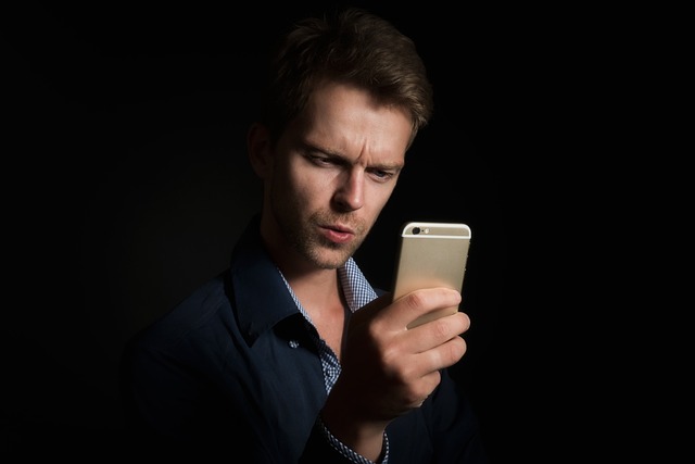 Person using JCPenney mobile app to find coupons and deals