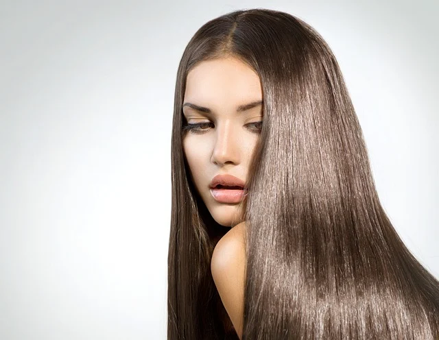 A woman with smooth, shiny, long brown hair