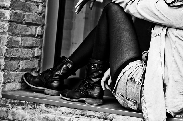 Street style outfit featuring a Vale hoodie layered with a jacket