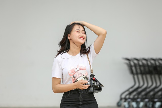 Student holding shopping bags with Alo Yoga logo