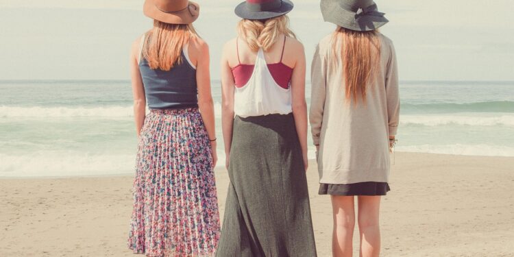 stylish women carrying discounted designer bags