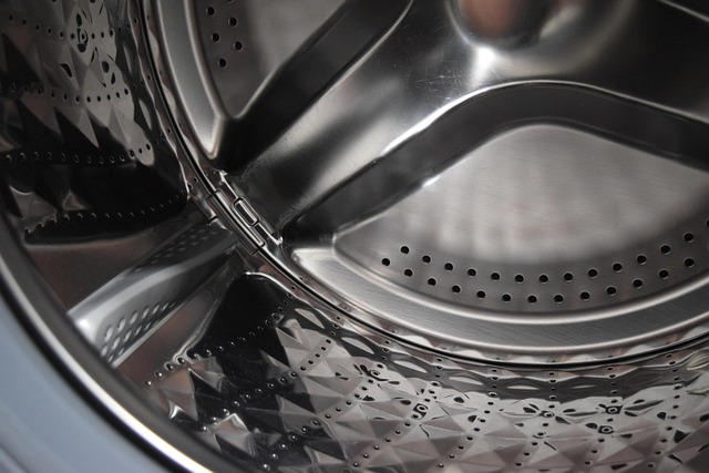 Washing machine with leggings inside and a drying rack with leggings laid flat