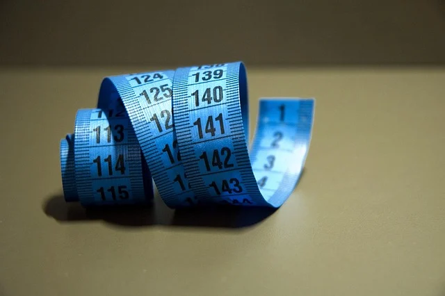 A coiled blue measuring tape